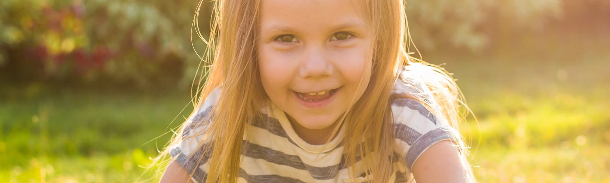 Girl on the meadow in the sun